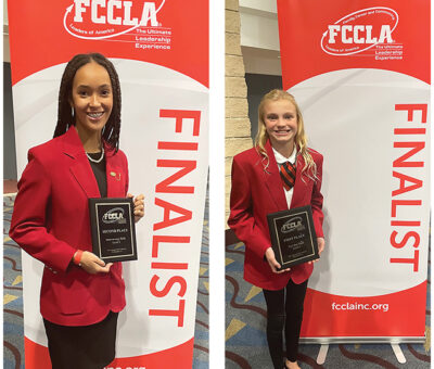 Clark FCCLA Finalists shows four teenage girls in red jackets and holding plaques