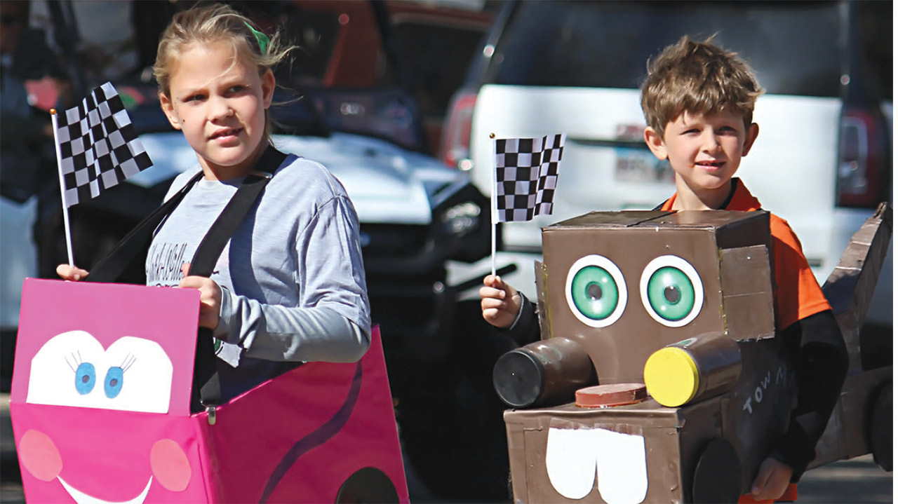 kids wearing cardboard car costumes