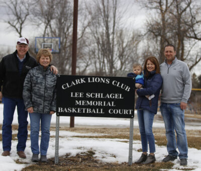 Schlagel family with sign