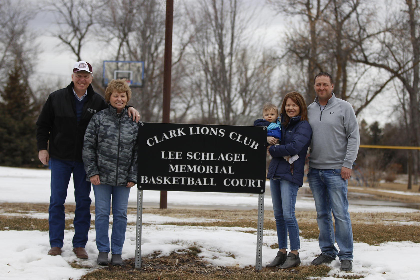 Schlagel family with sign