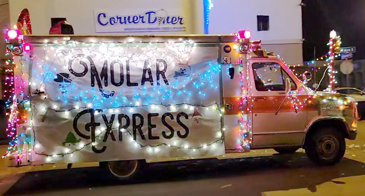 parade of lights van with molar express written on the side