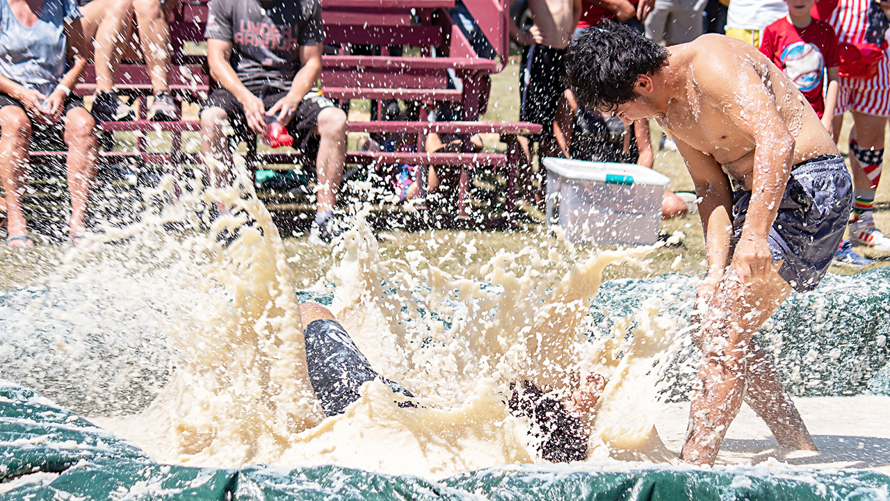 people wrestling in mashed potatoes