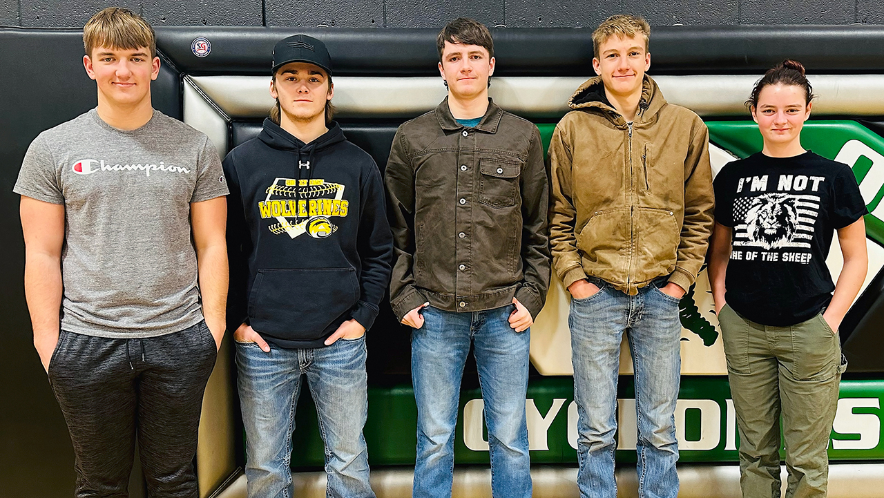 senior wrestlers, four teenage boys and one teenage girl standing in a row